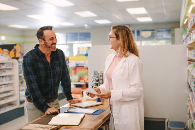 customer talking with female chemist at the drug store