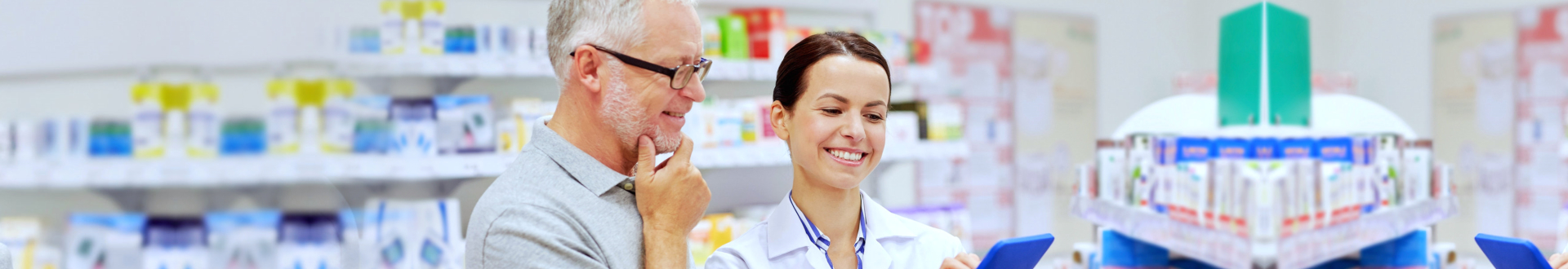 photo of a happy senior man with a pharmacist